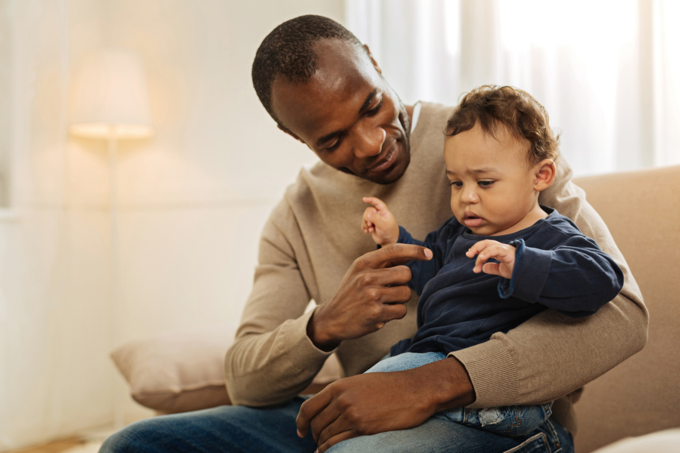 man holding toddler