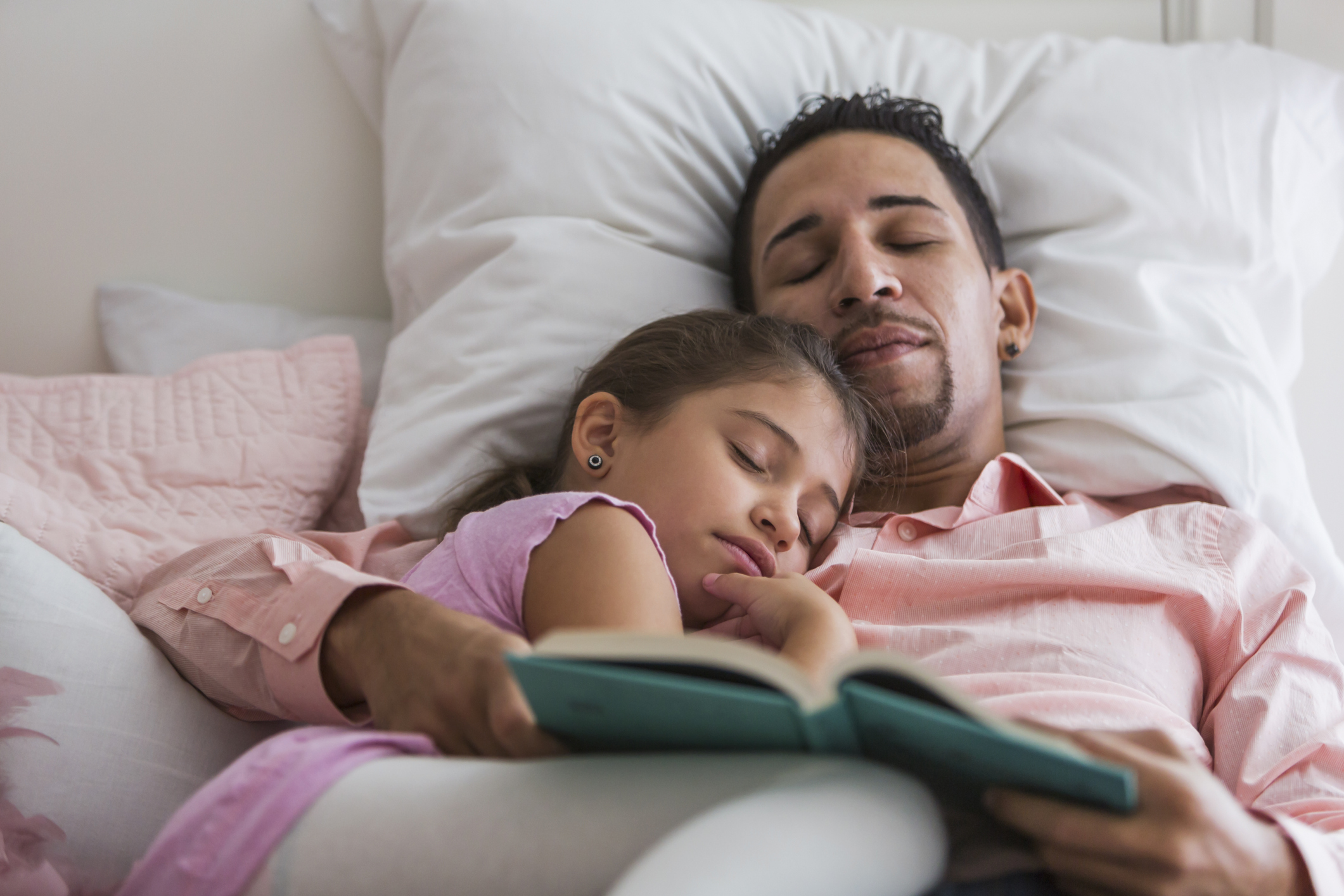 Father reading bedtime story to little girl, fell asleep
