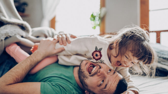 dad playing with daughter