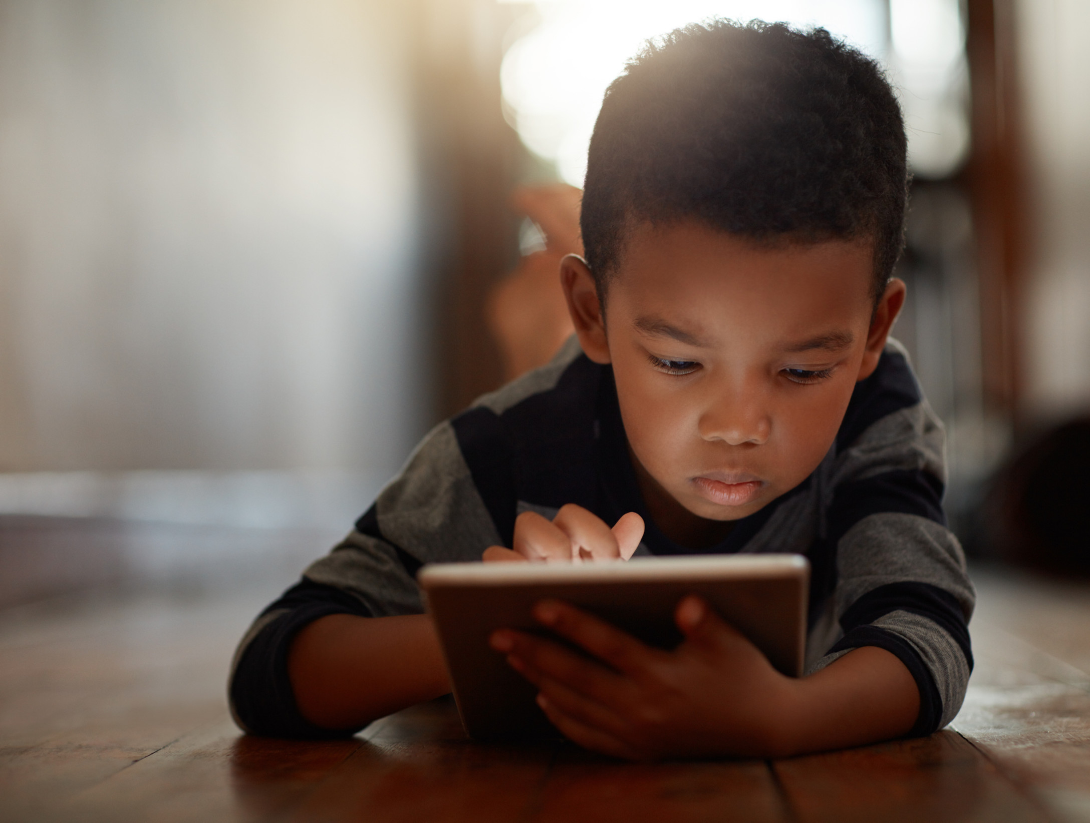 Boy looking at tablet