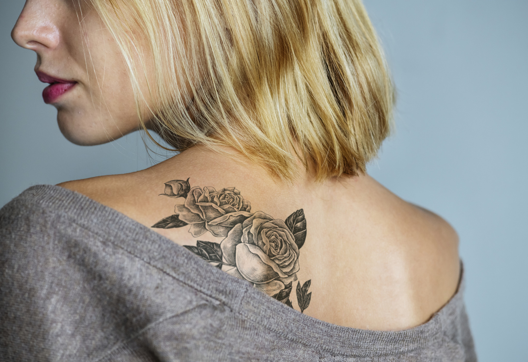 woman with flower tattoo