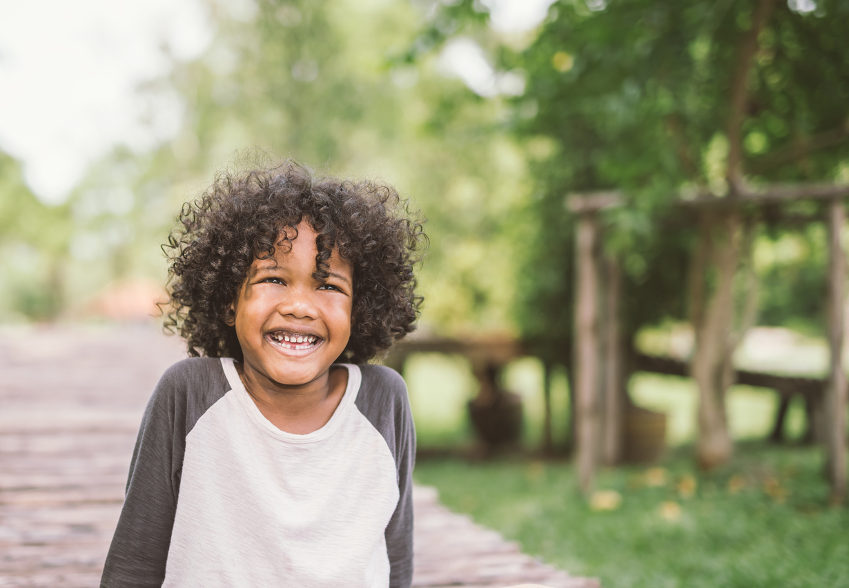 portrait of a cute african american little boy smiling.
