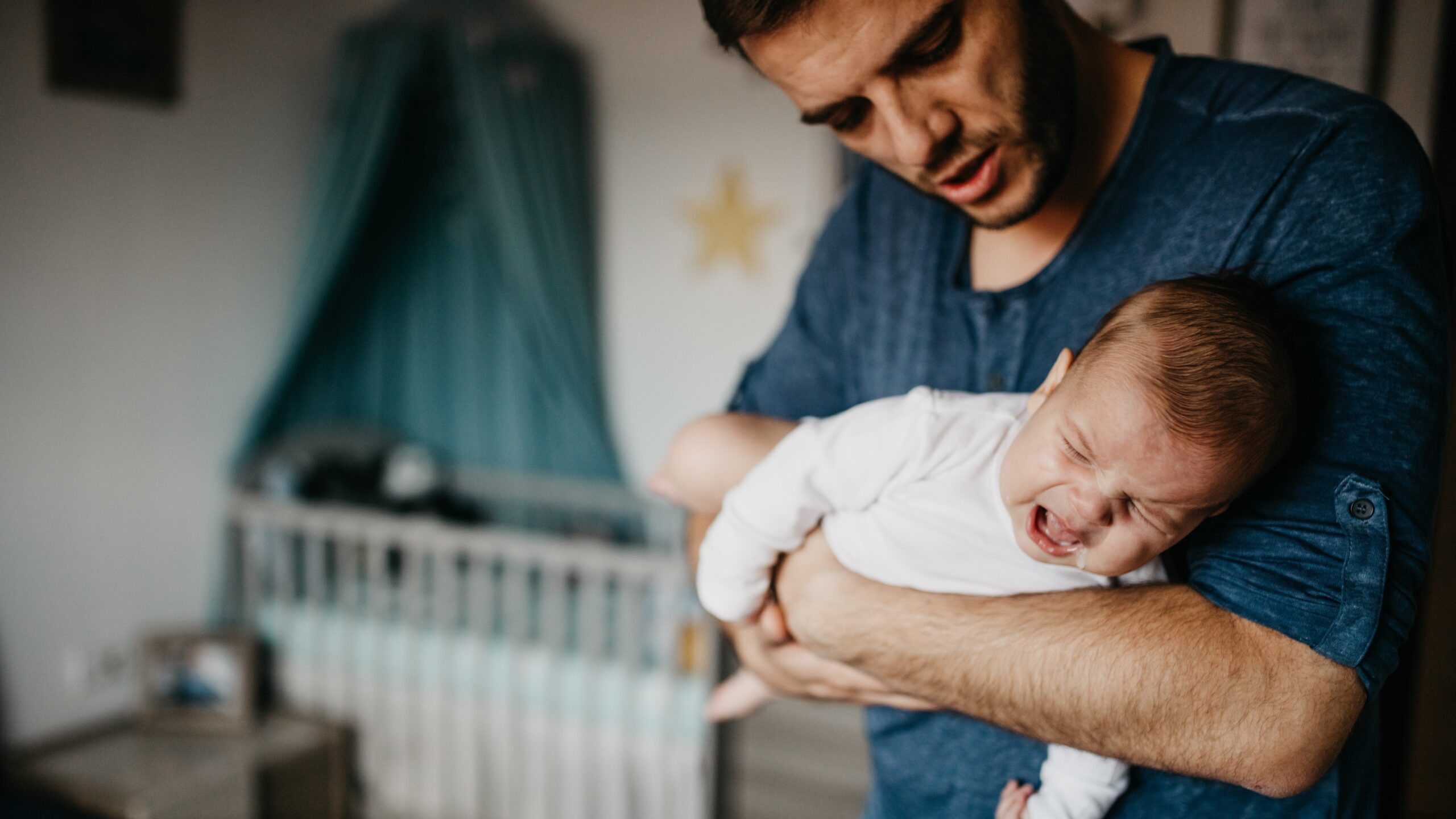 Dad with newborn crying