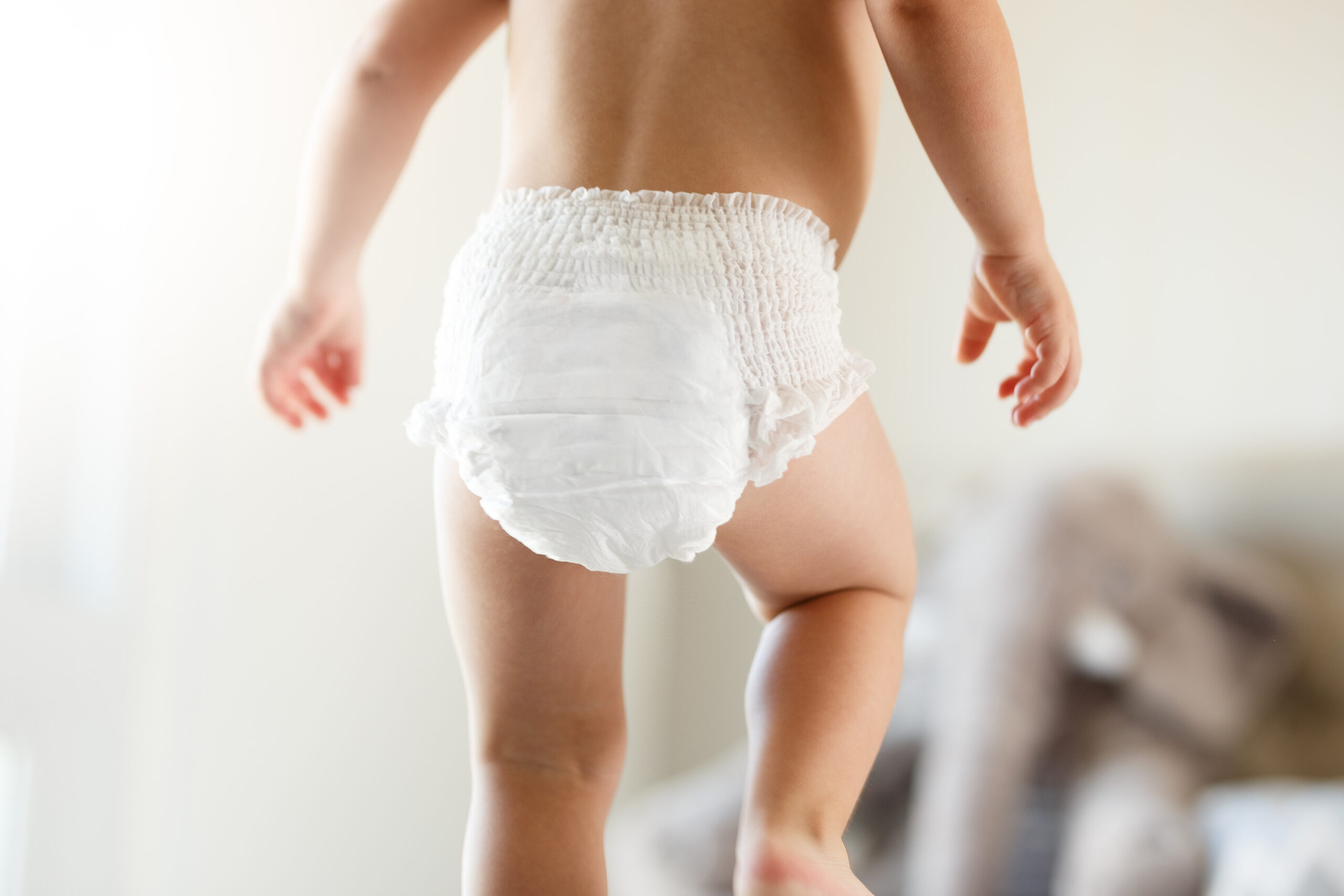 Cute baby using diapers