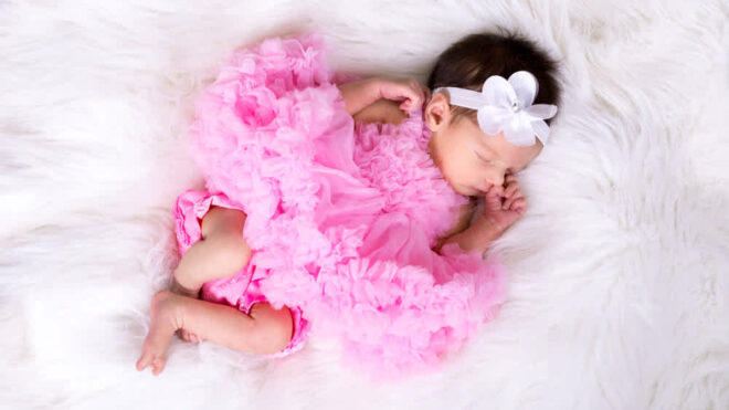 baby girl in pink dress
