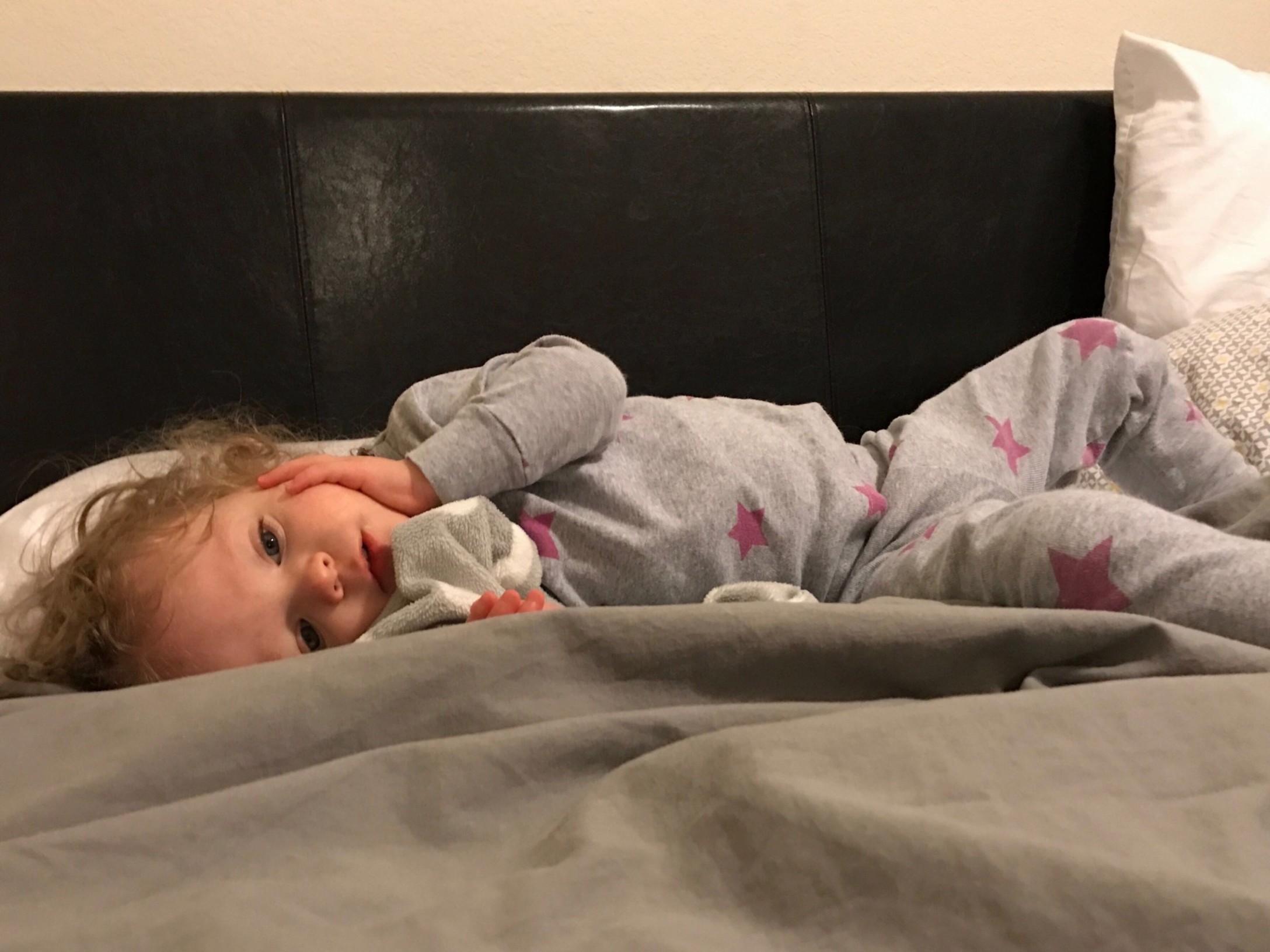 little-girl-wearing-pajamas-lying-in-the-big-bed-not-feeling-well-indoors-bedroom-room-bed-sick-sick_t20_xvEQ61.jpg