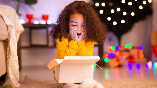 little girl looking into box