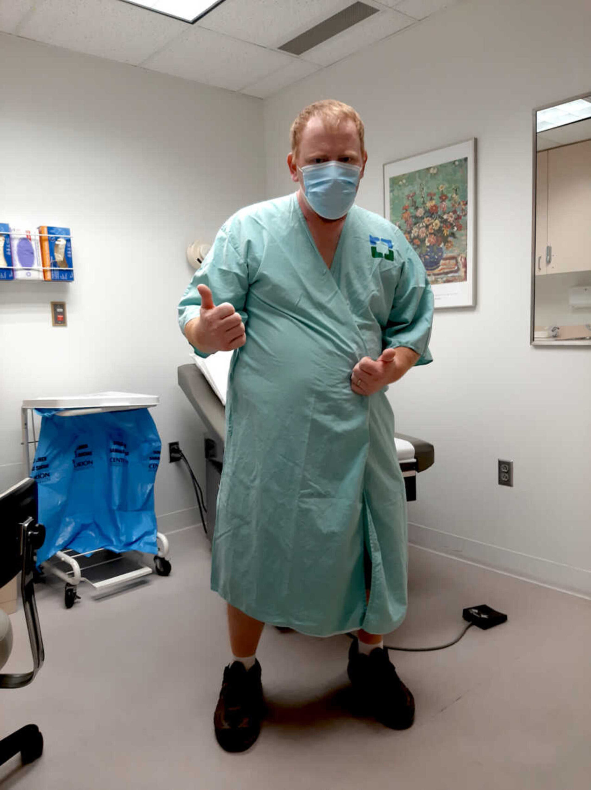 man-in-hospital-gown-thumbs-up-900x1203-1.jpg