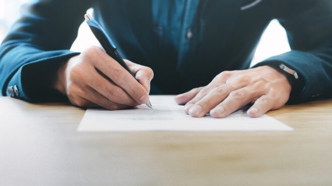 man writing letter