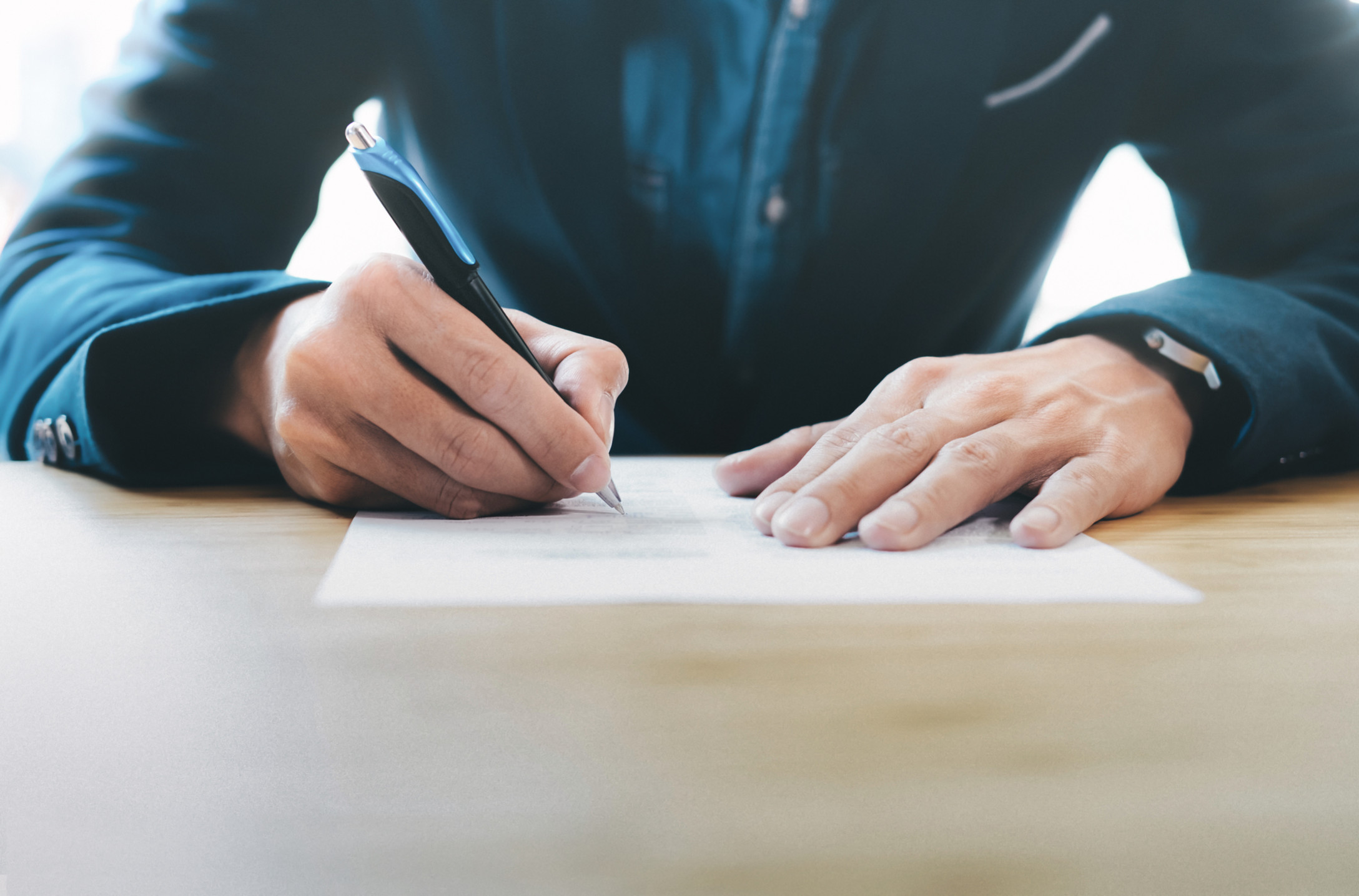 man writing letter