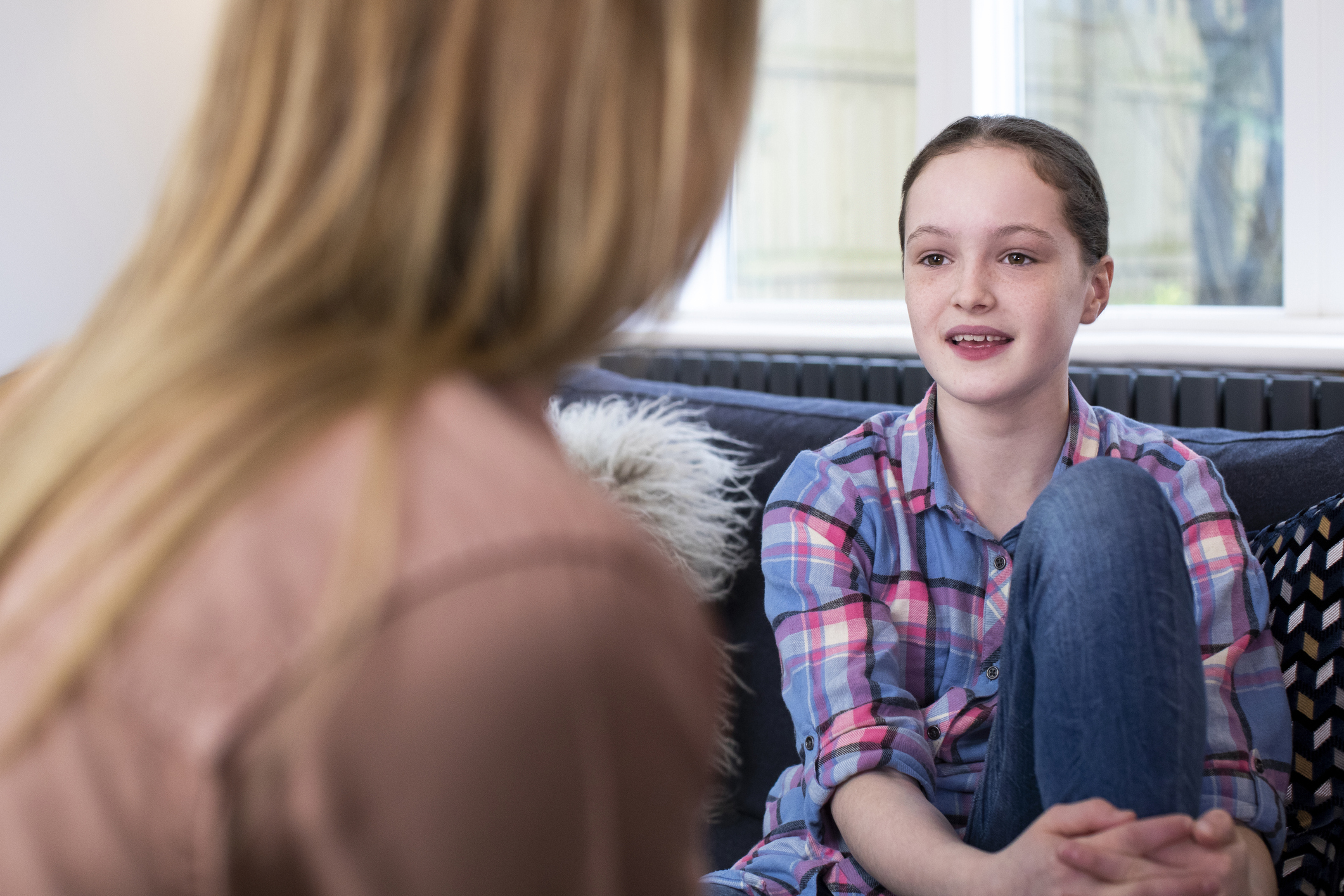 Mother Having Serious Conversation With Young Daughter At Home