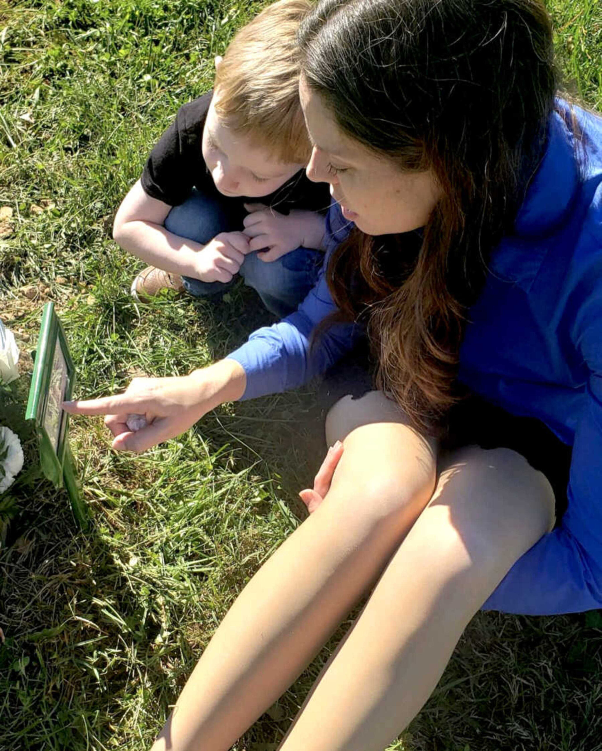 mom-with-child-at-sons-grave-900x1123-1.jpeg