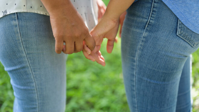 mom & teen holding hands