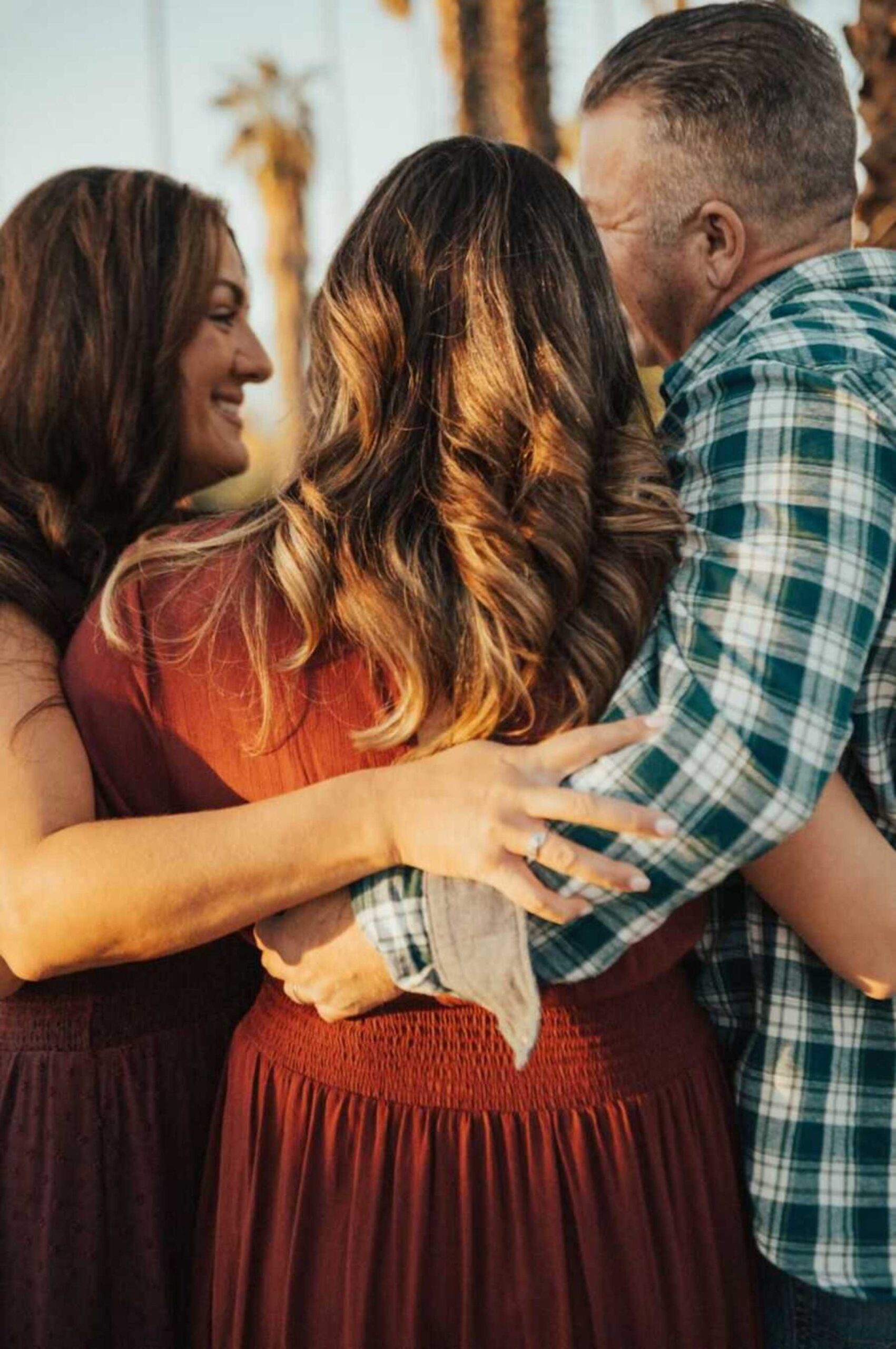 parents-put-arms-around-daughter-900x1354-1.jpeg