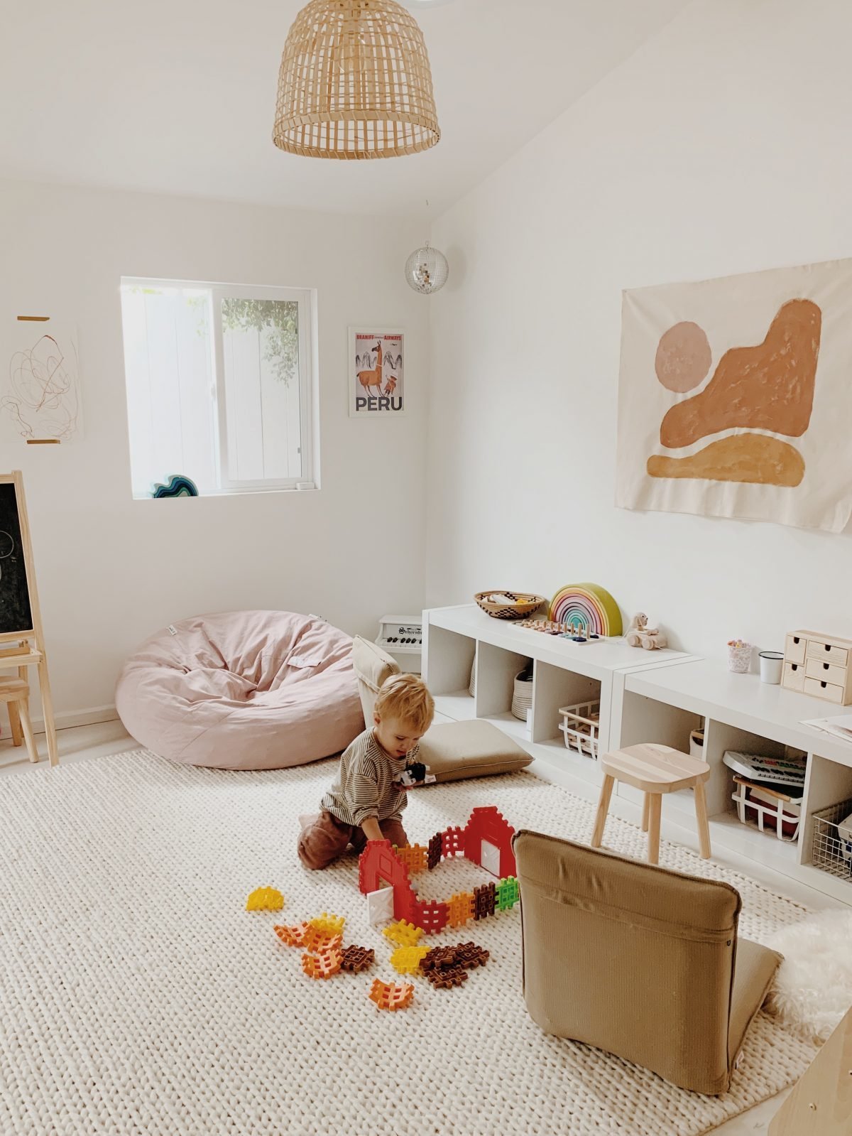 Toddler boy playing with farm blocks