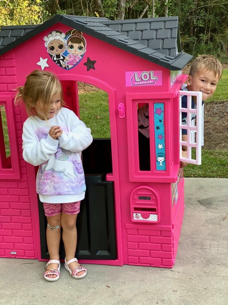 Preschool girl with LOL Surprise Cottage