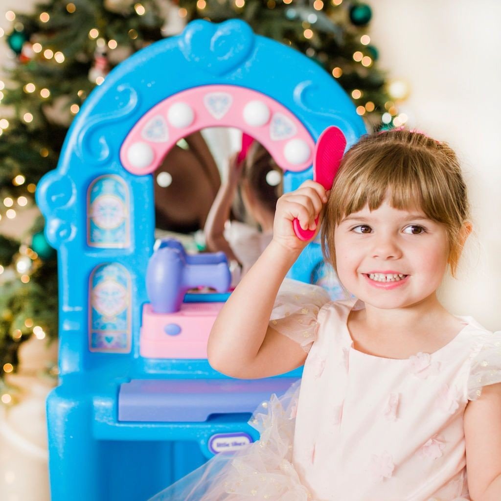 little girl playing with comb in Little Tikes Ice Princess Magic Mirror Set