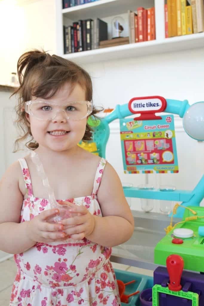 Preschooler with Little Tikes STEM lab and goggles