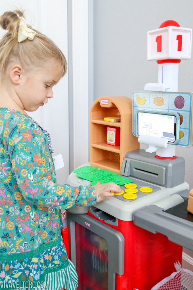 Little girl counting toy money