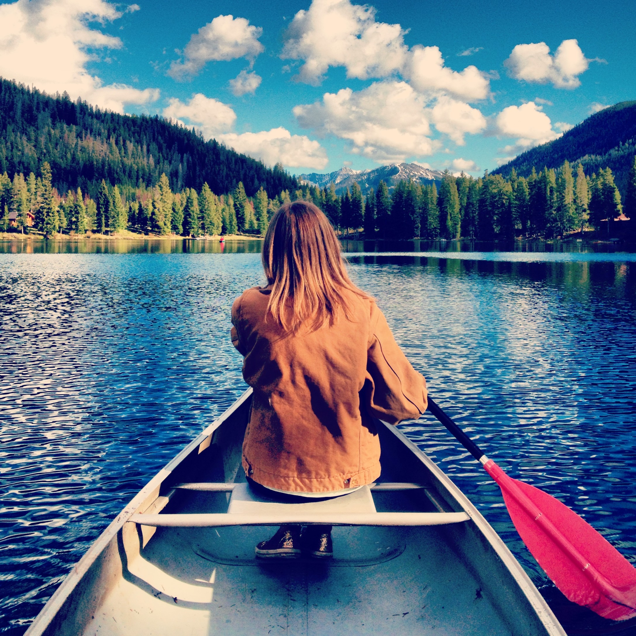 rear-view-of-woman-paddling-in-lake_t20_ZLx01n.jpg