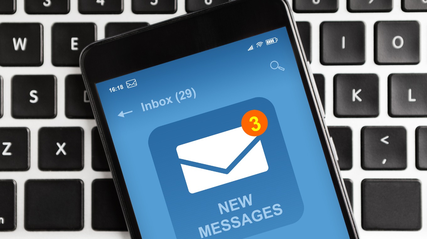 smartphone-with-new-email-message-notification-on-screen-lying-on-picture-id1250219390.jpg