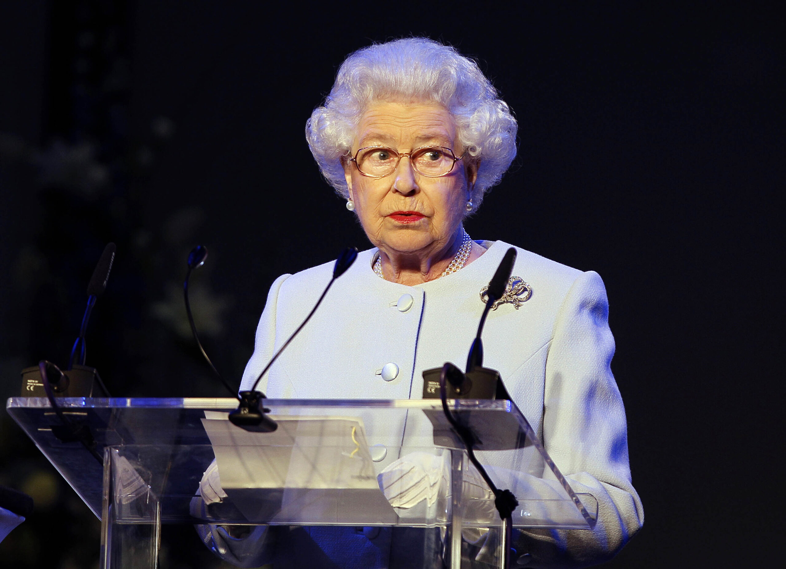 Queen Elizabeth listens to a speech by King Constantine of the Hellenes at Wellinton College in Berkshire, England