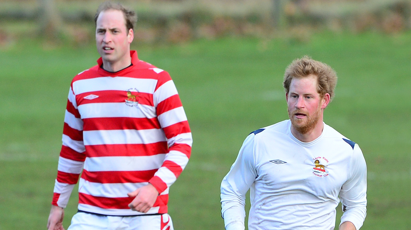 Prince William and Prince Harry play in a charity football match