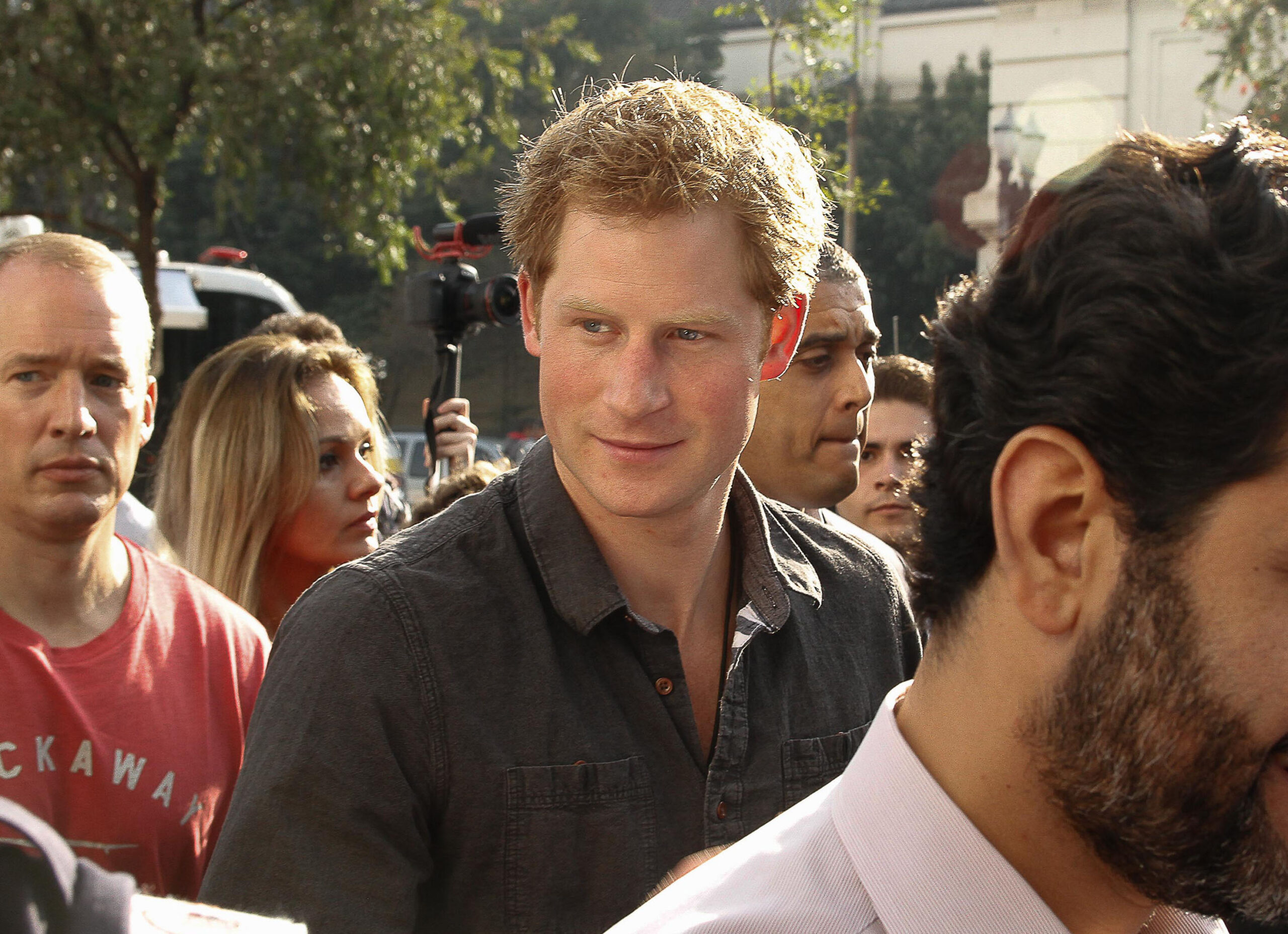 Prince Harry visits the Cracolandia neighborhood in Sao Paulo, accompanied by the city's mayor Fernando Haddad