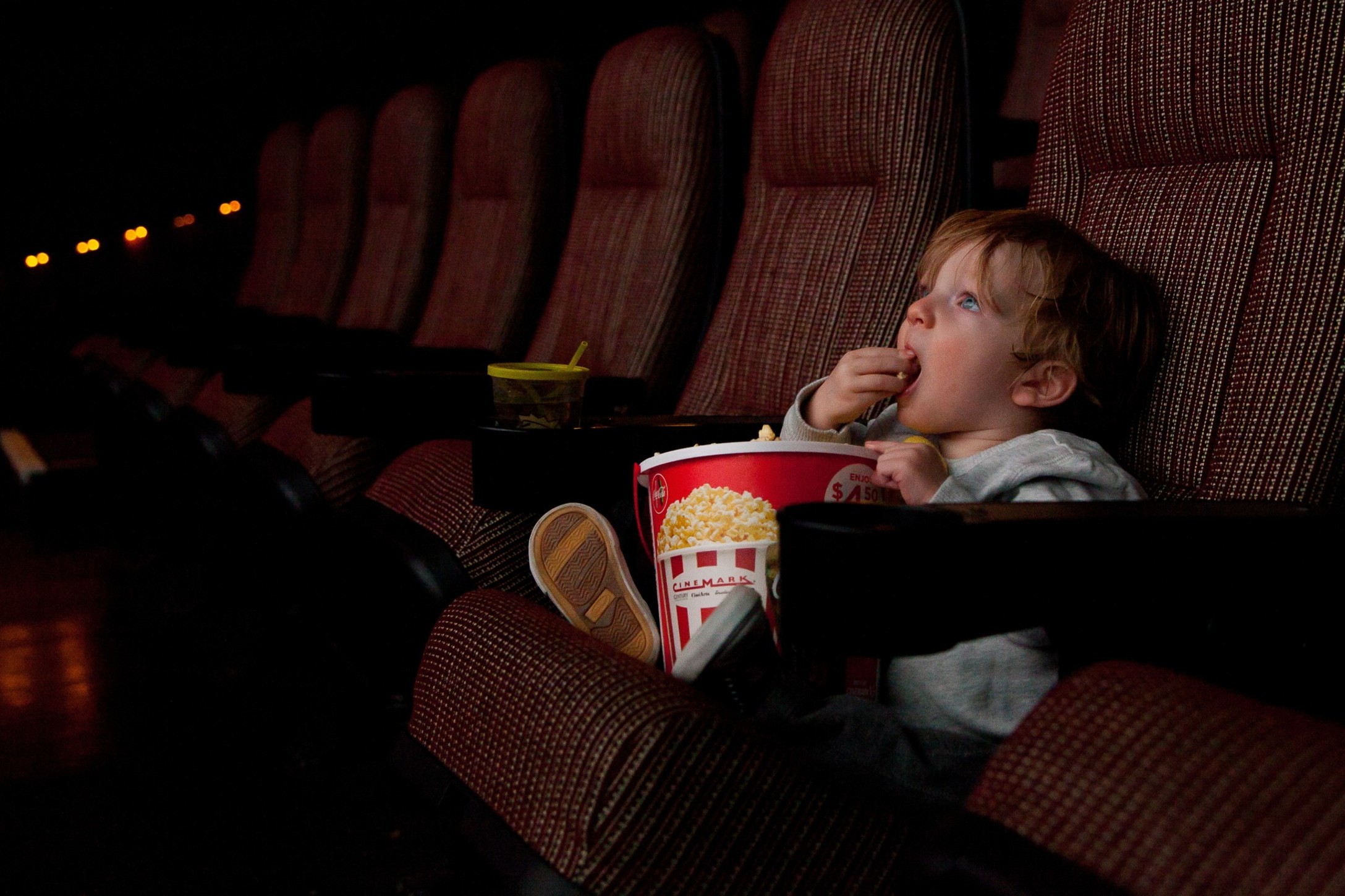 toddler-eating-popcorn-at-the-movie-theatre_t20_px6GLj.jpg