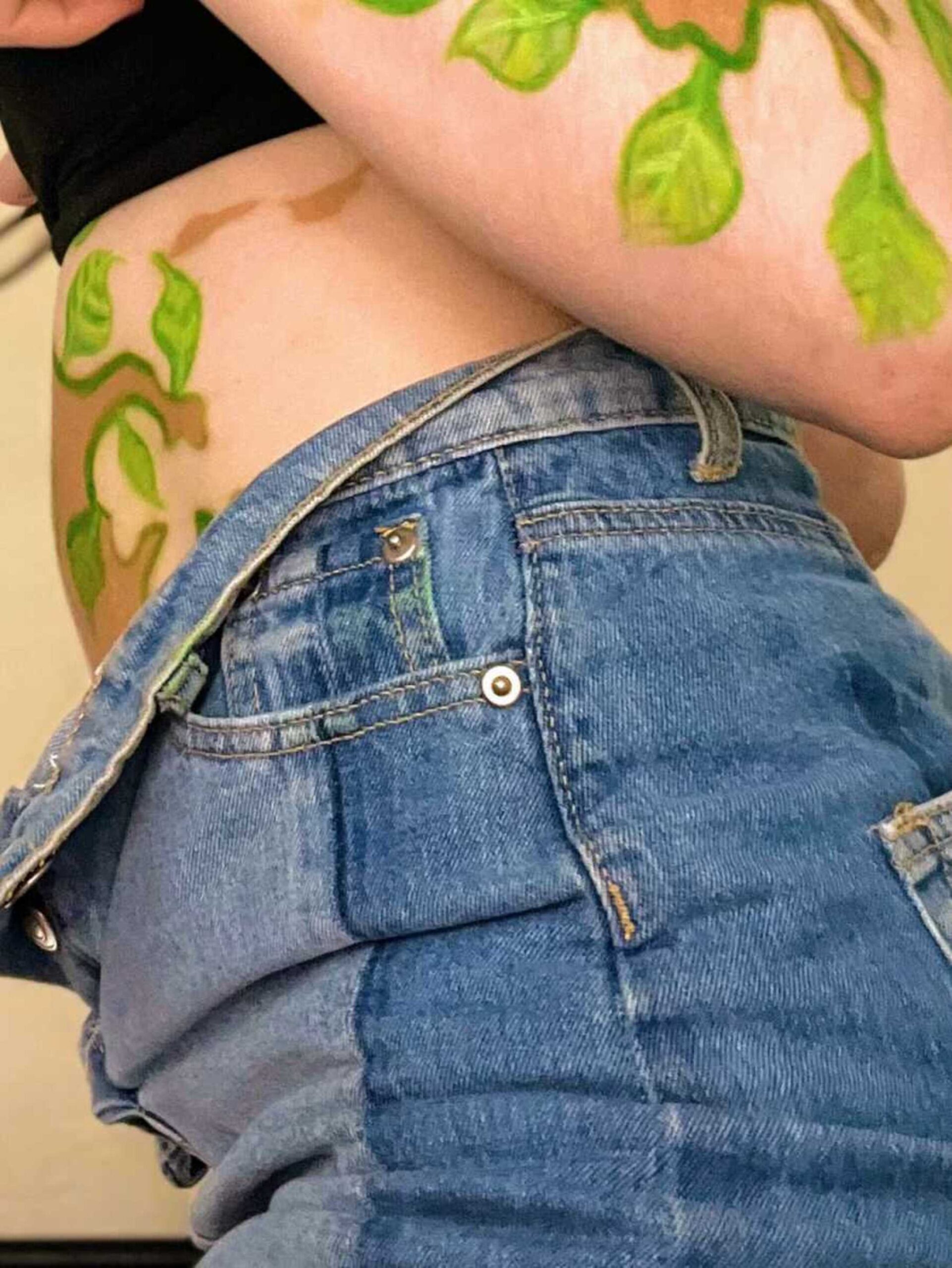 vitiligo-girl-with-painted-leaves-900x1199-1.jpeg