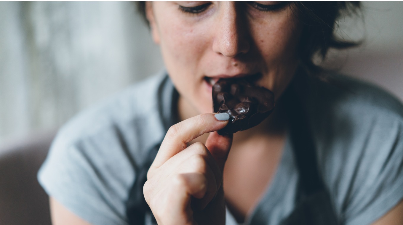 woman-eating-chocolate-picture-id1127373809.jpg