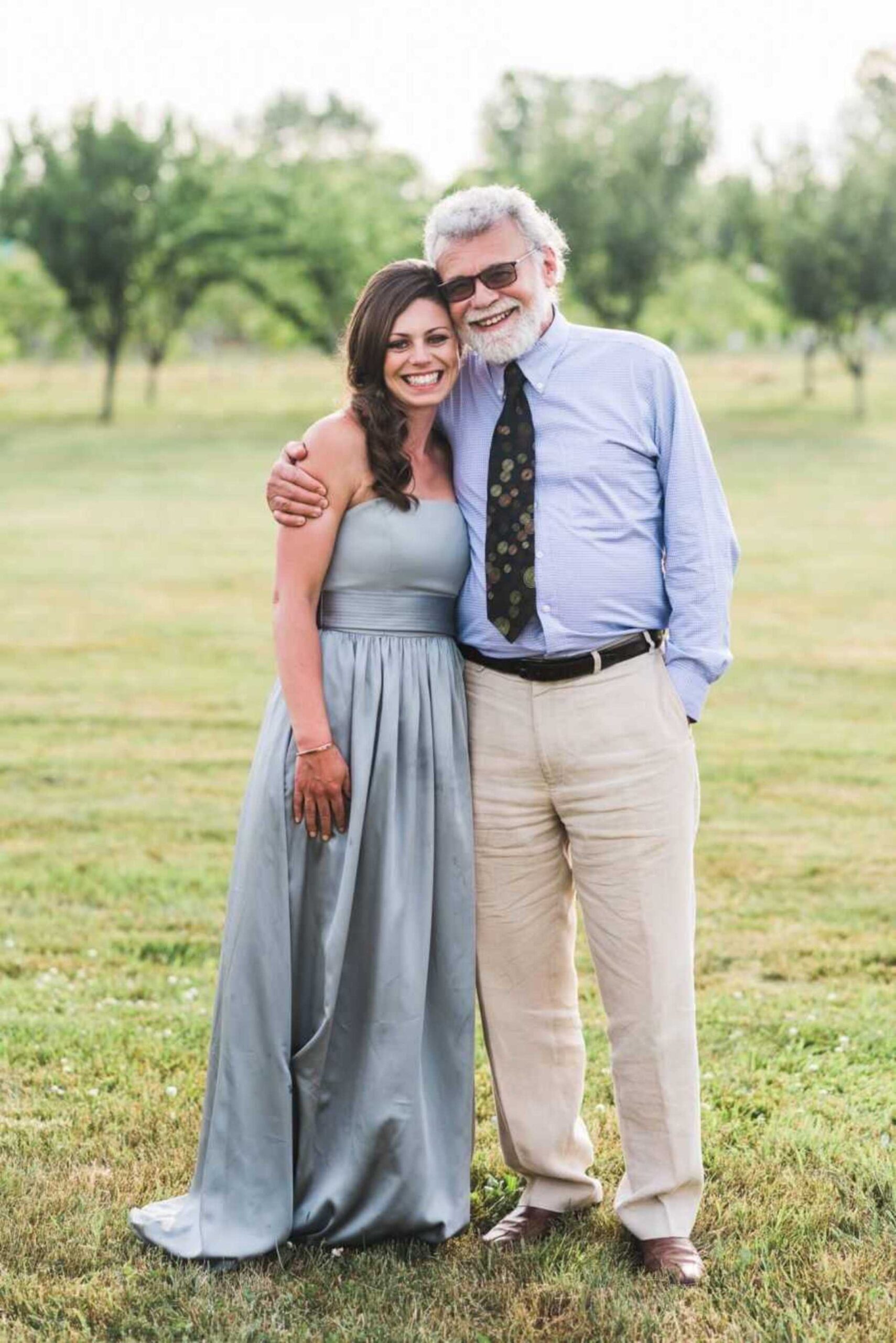 woman-smiling-alongside-father-900x1348-1.jpeg