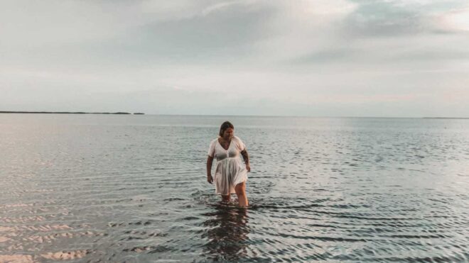 woman walking in shallow water