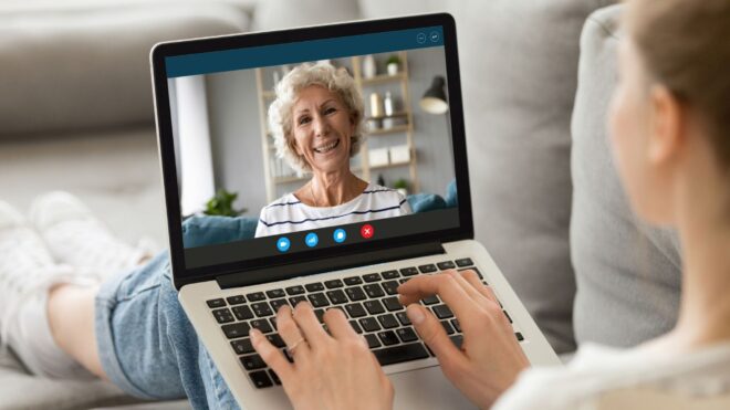woman talking virtually using a computer