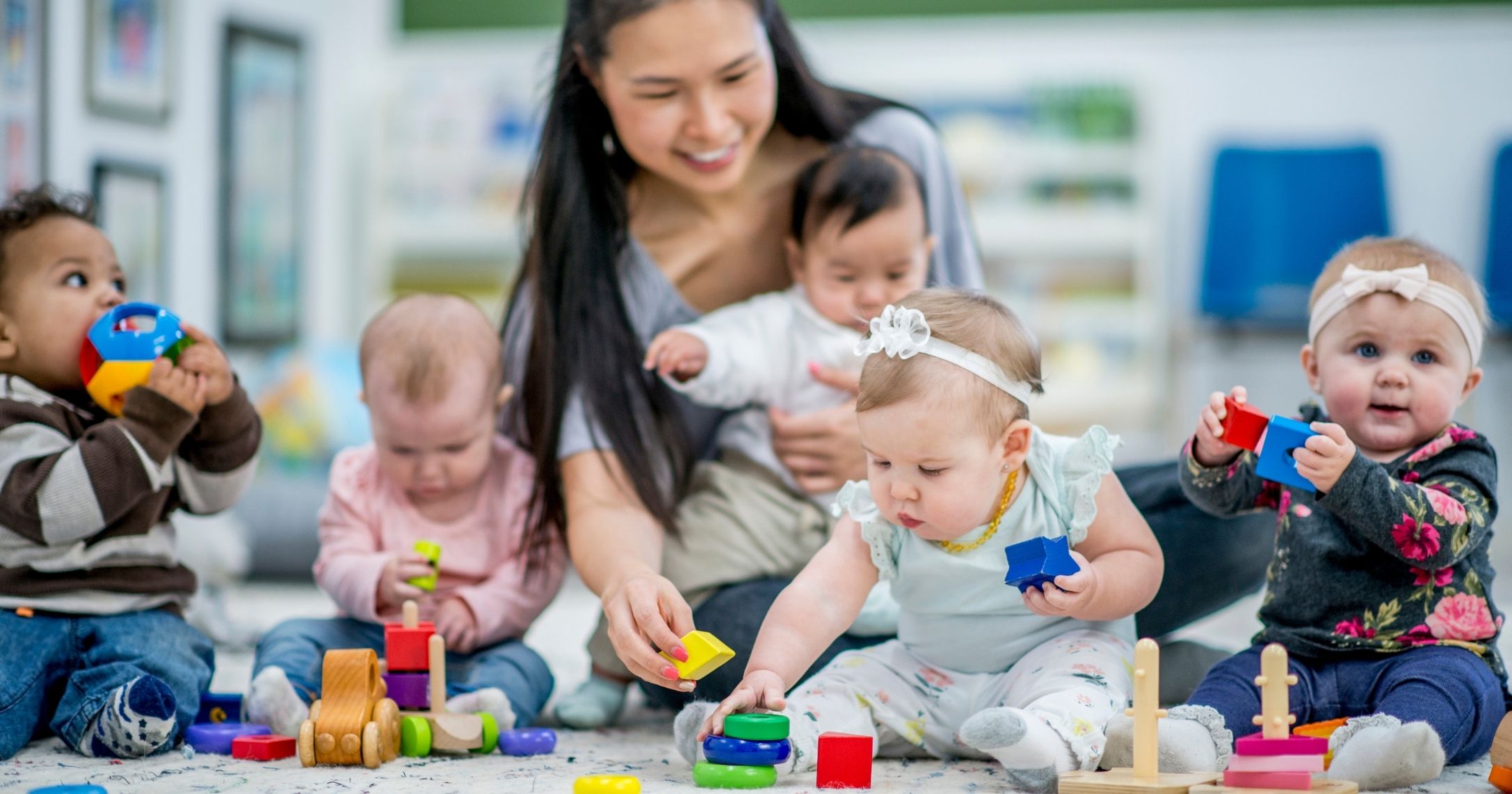 woman_caring_babies_daycare.jpg woman_caring_babies_daycare.jpg