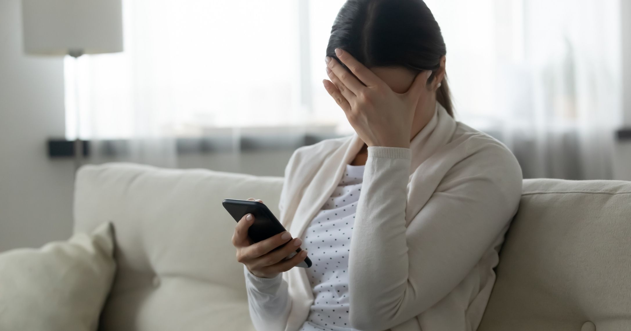 woman scared phone