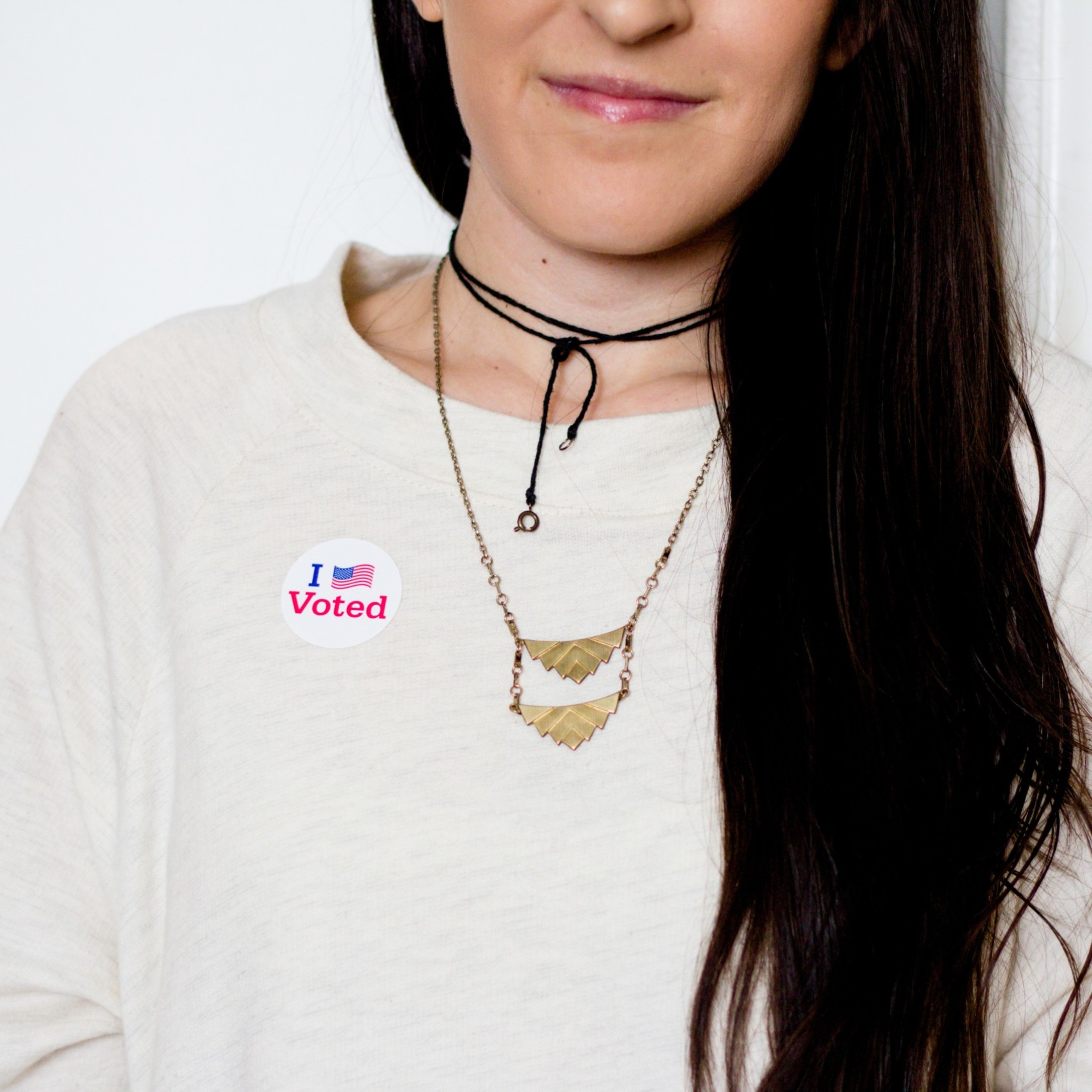 young-woman-with-i-voted-sticker_t20_kROmjp.jpg