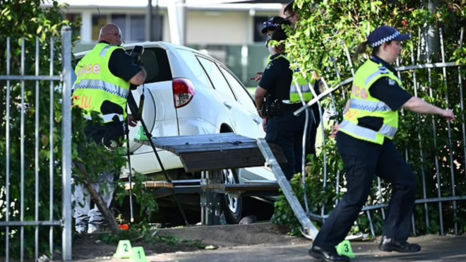 Melbourne police outside of Auburn South Primary School after car crash