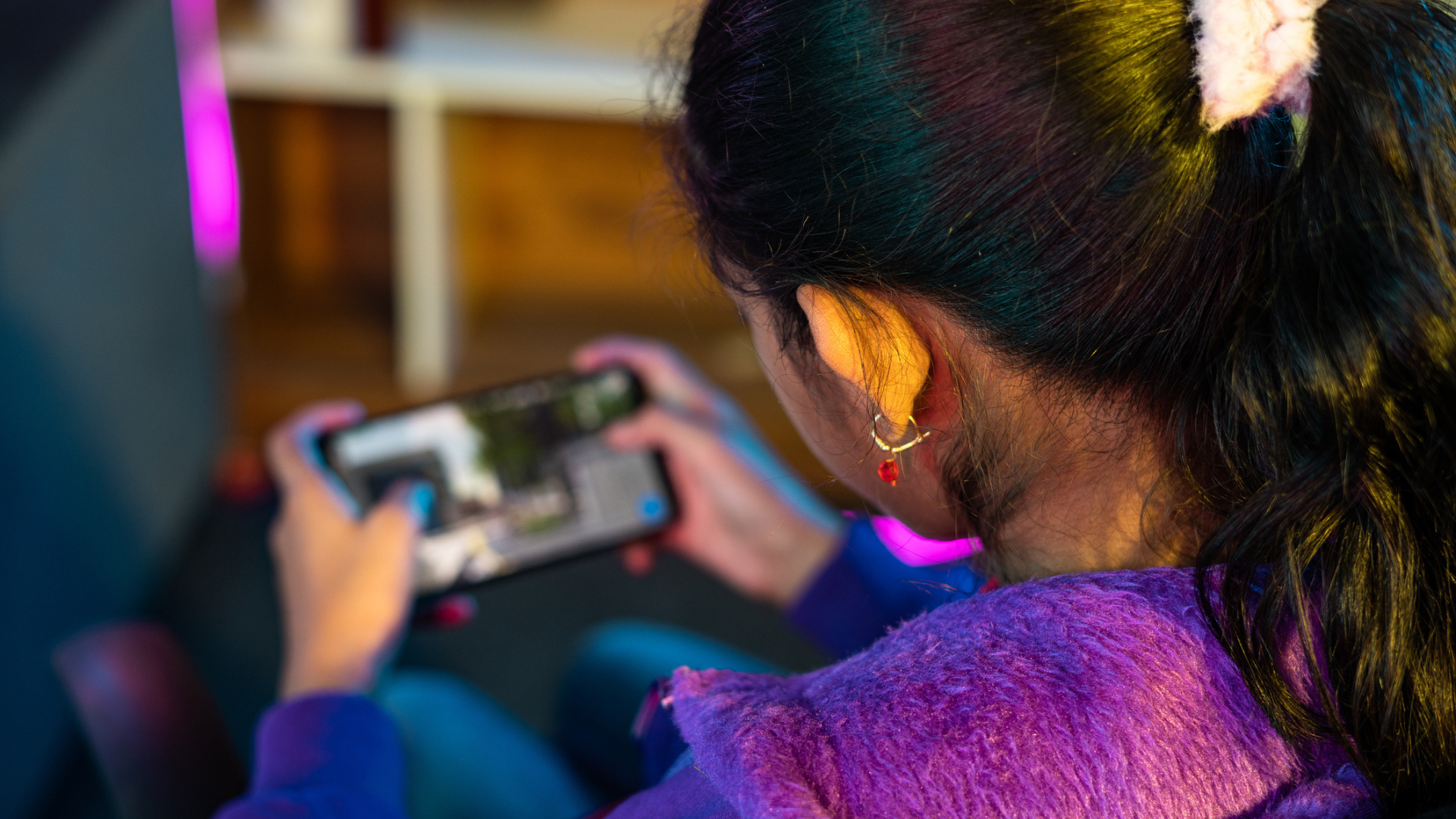 girl playing a game on her phone