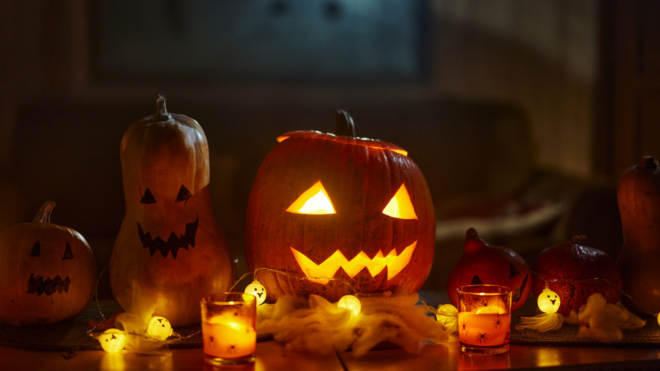 Halloween jack-o-lanterns and lit candles