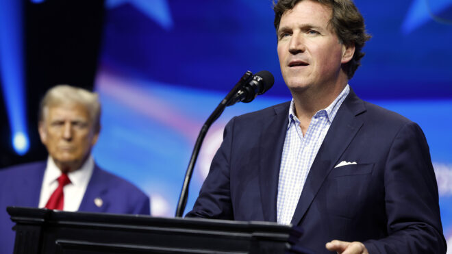 Political Commentator Tucker Carlson speaks alongside Republican presidential nominee, former U.S. President Donald Trump during a Turning Point Action campaign rally at the Gas South Arena on Oct, 23, 2024, in Duluth, Georgia. Trump is campaigning across Georgia today as he and Democratic presidential nominee, U.S. Vice President Kamala Harris attempt to win over swing state voters. (Anna Moneymaker/Getty Images/TNS)