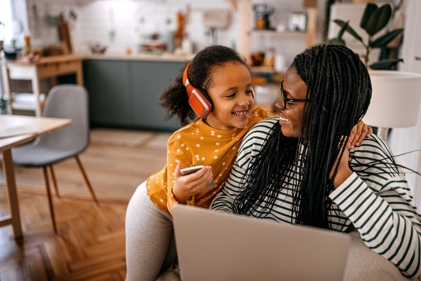 Mom and daughter listening to music