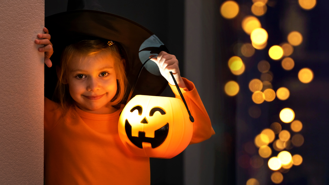 Girl holding a Halloween bucket