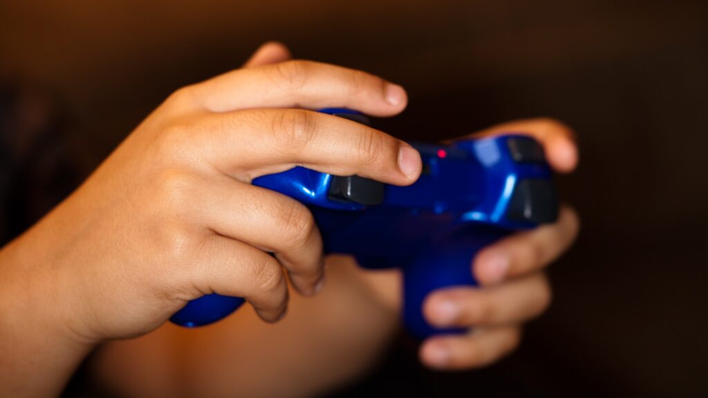 a girl's hands playing video games