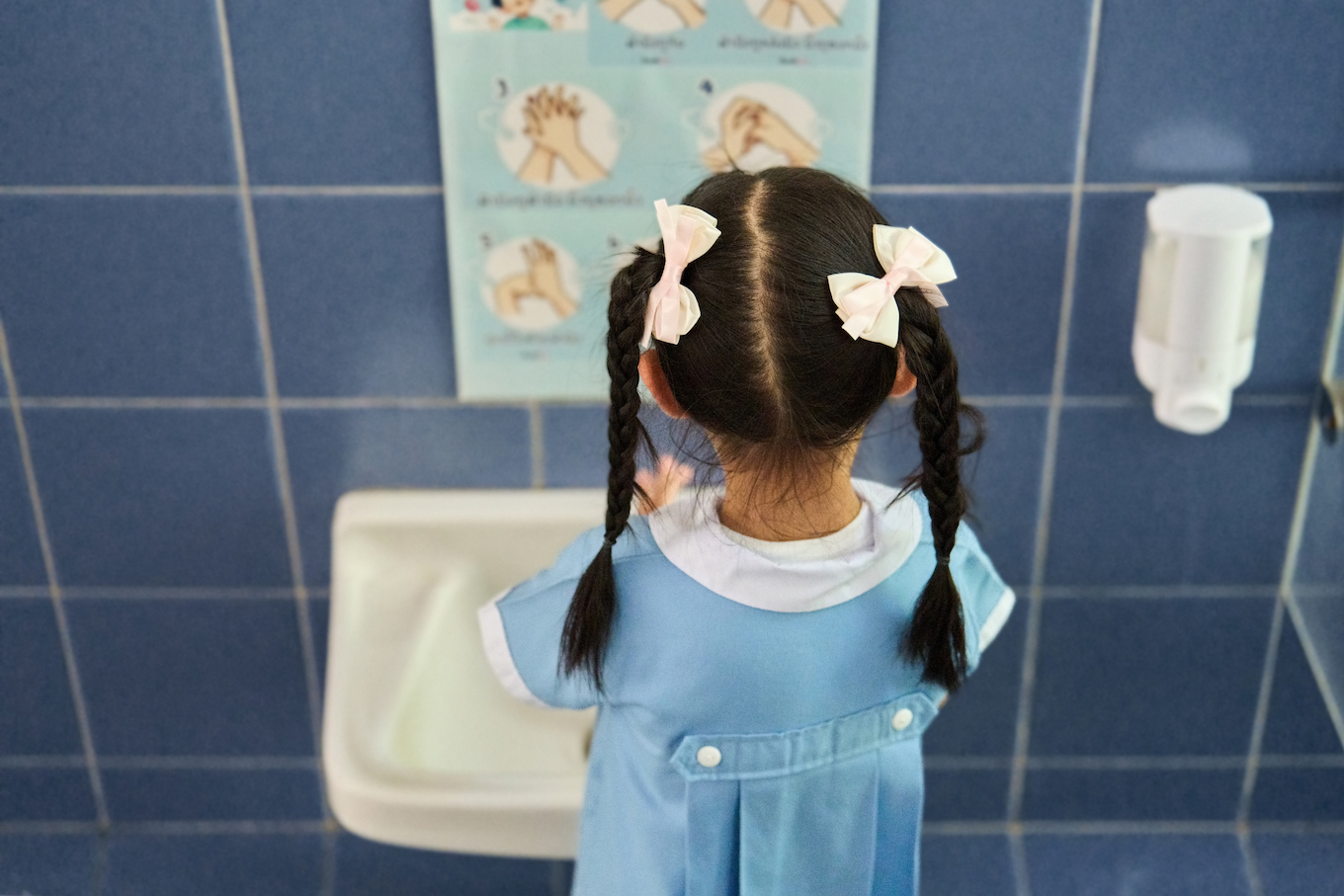 girl washing her hands
