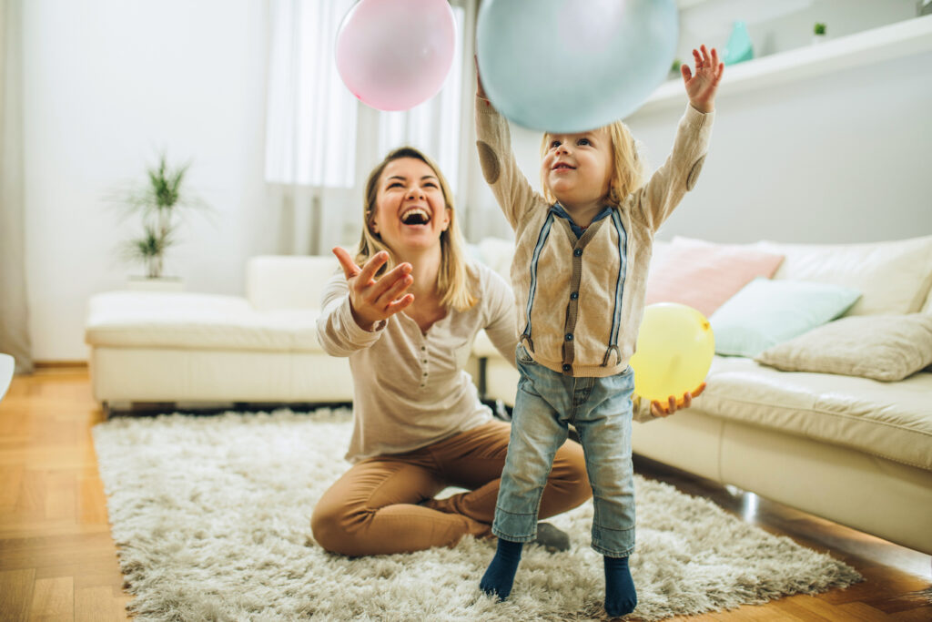 Mom and son playing with balloons