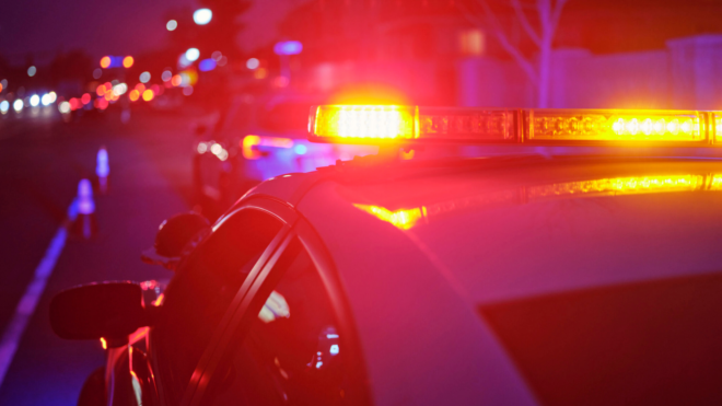 the top of a police car, with the siren lights on