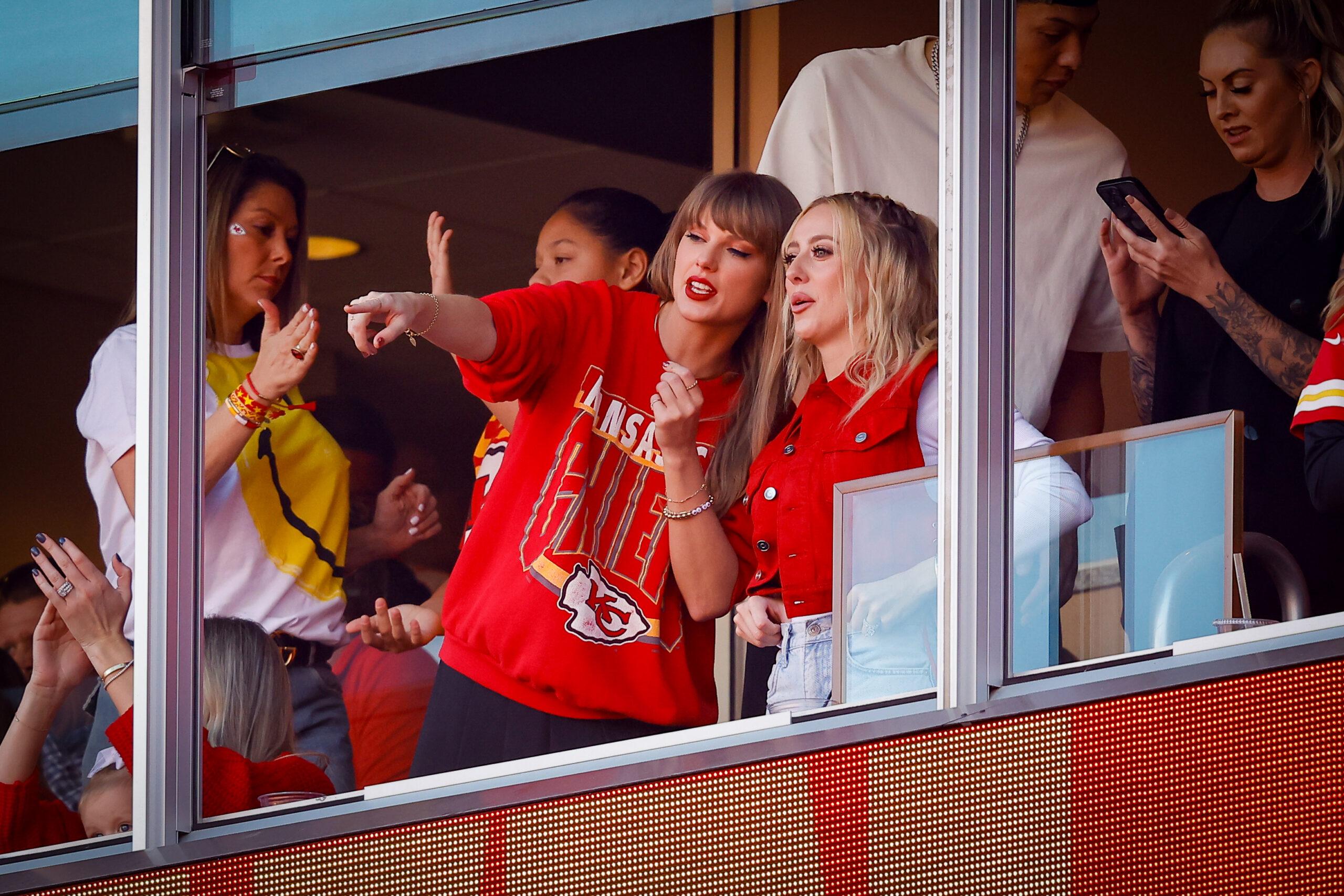 KANSAS CITY, MISSOURI - OCTOBER 22: Taylor Swift and Brittany Mahomes react during a game between the Los Angeles Chargers and Kansas City Chiefs at GEHA Field at Arrowhead Stadium on October 22, 2023 in Kansas City, Missouri. (Photo by David Eulitt/Getty Images)