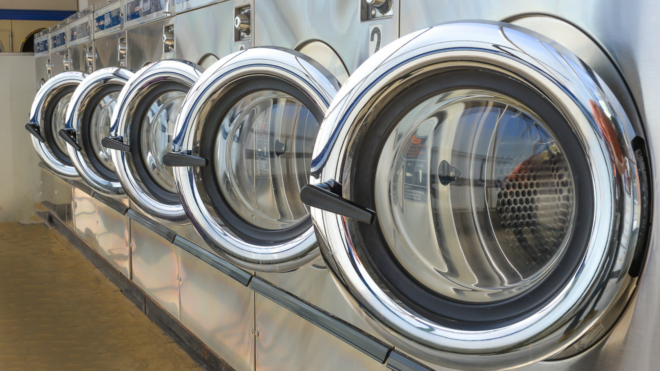 a row of laundromat machines