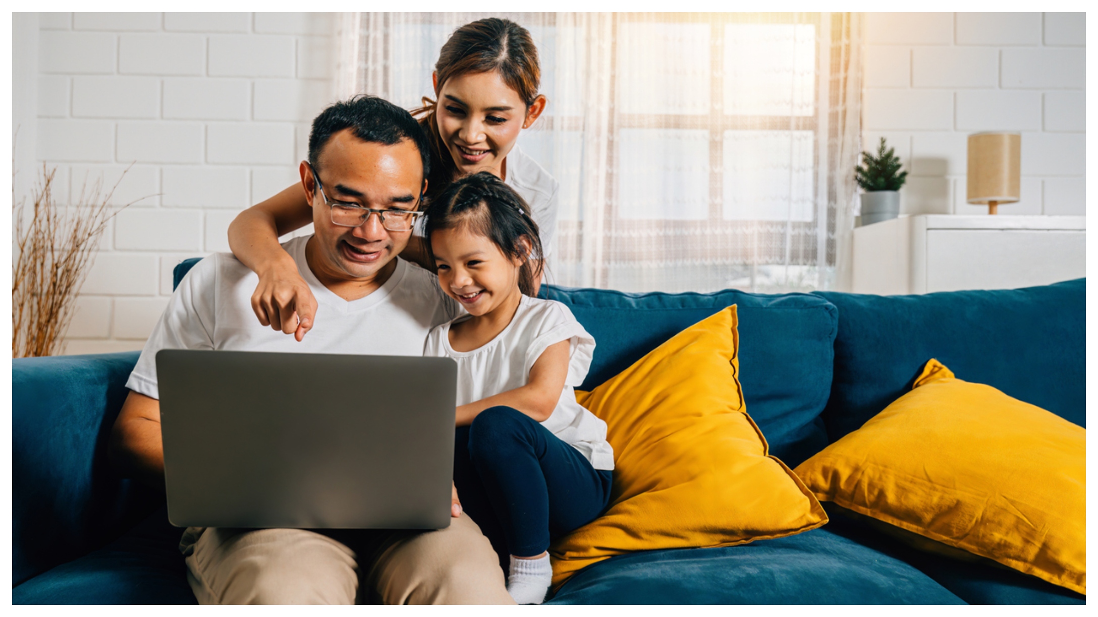 family on laptop together